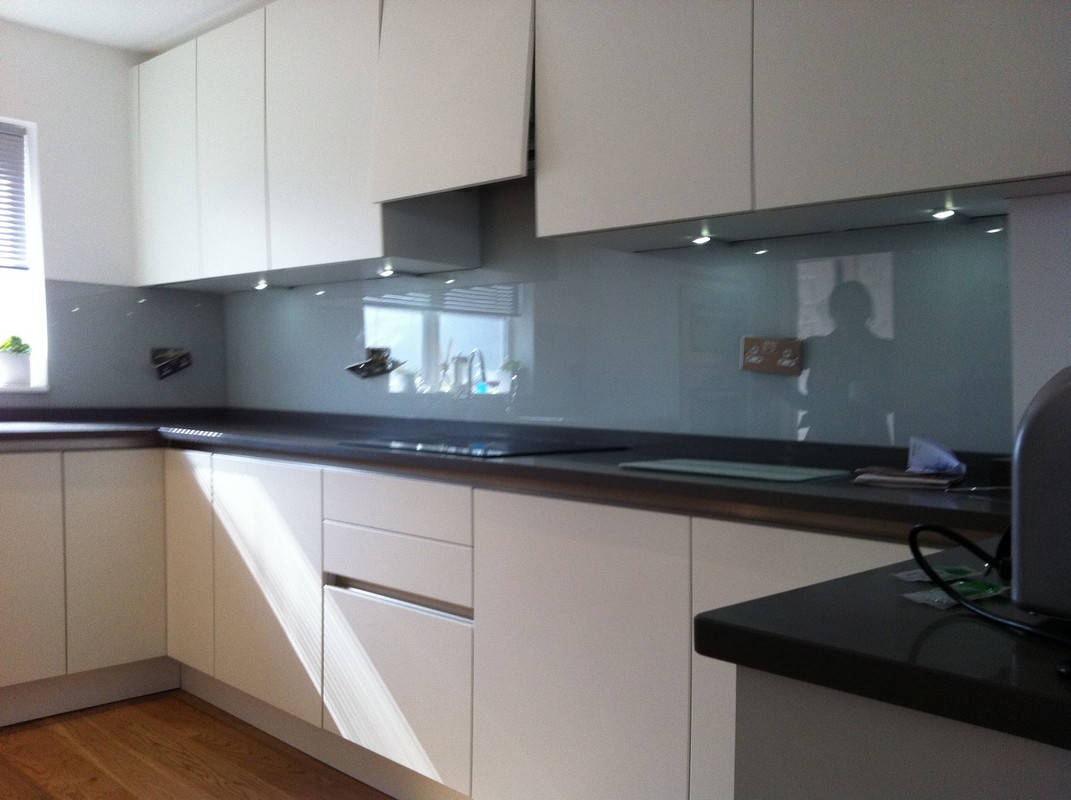 Grey glass kitchen splashback with LED lighting in Leytonstone