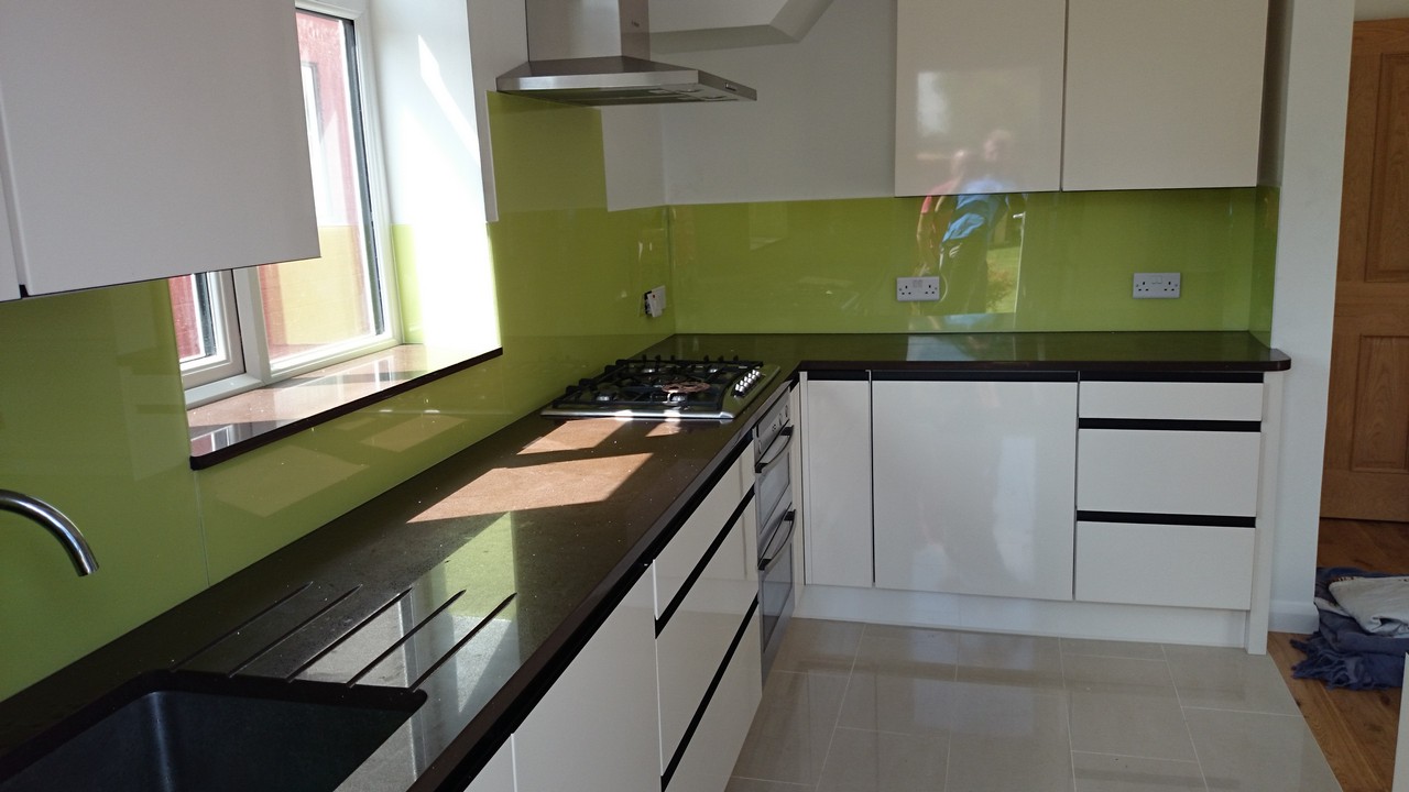 Lime green glass kitchen splashback installed by Leytonstone glaziers