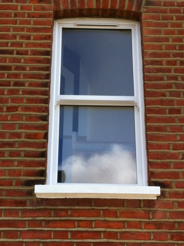 uPVC sash window on Victorian red brick house in Leytonstone